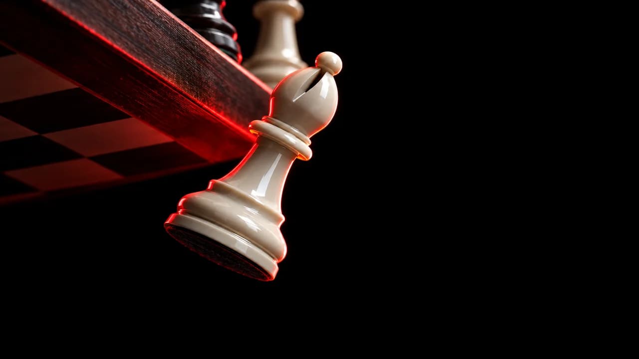 Chess blunder thumbnail: low-angle shot of a white bishop falling off the edge of the board into darkness under a red rim light, no text